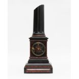 Clock in black Belgian marble and red granite with broken column, 19th century