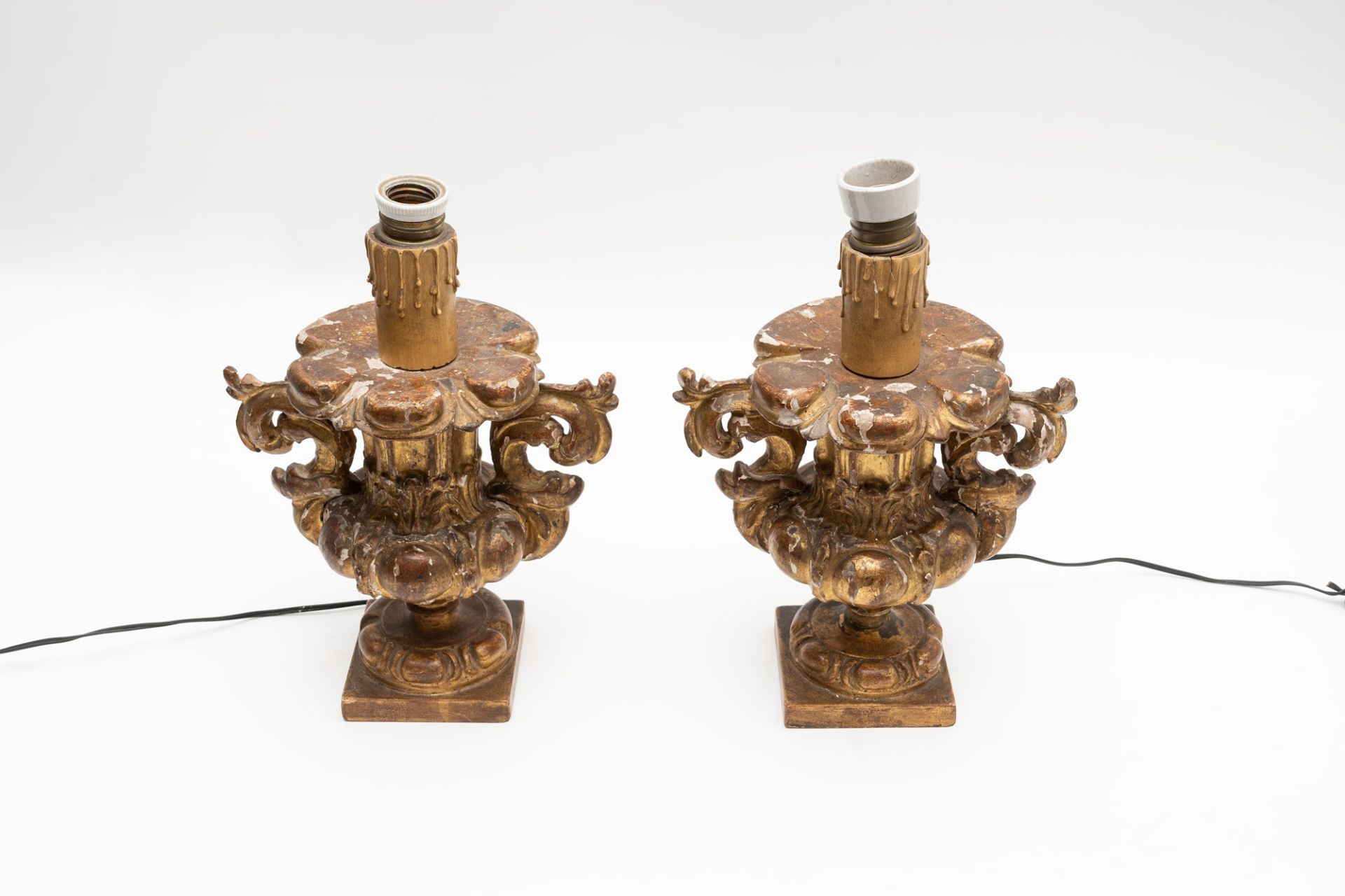 Two carved and gilded wooden candle holders, 18th century