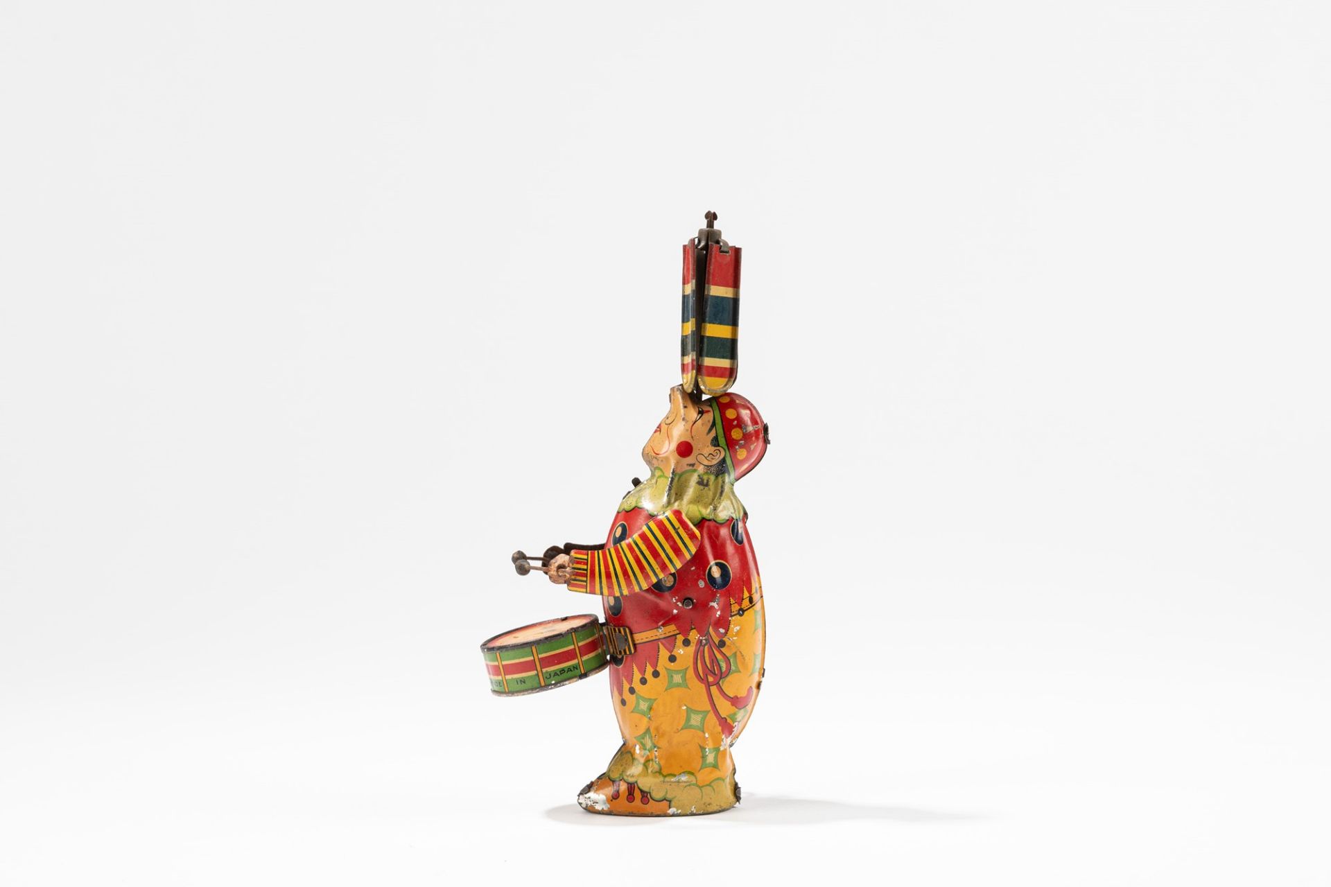 Clown with drum and spinning umbrella, 1930-1940