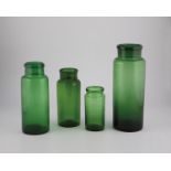 Four storage jars, 19th century, green glass. Cylindrical wall. The muzzle rim is folded outwards.