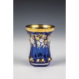 Mug Bohemia, ca. 1840 Cobalt blue glass. Faceted base with high-cut, gilded tubers. Sixfold faceted,