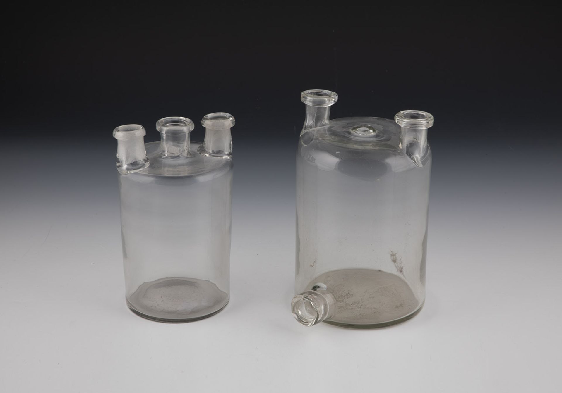 Two pharmacy bottles (so-called Woulfesche bottles) Germany, 19th century Colourless glass.
