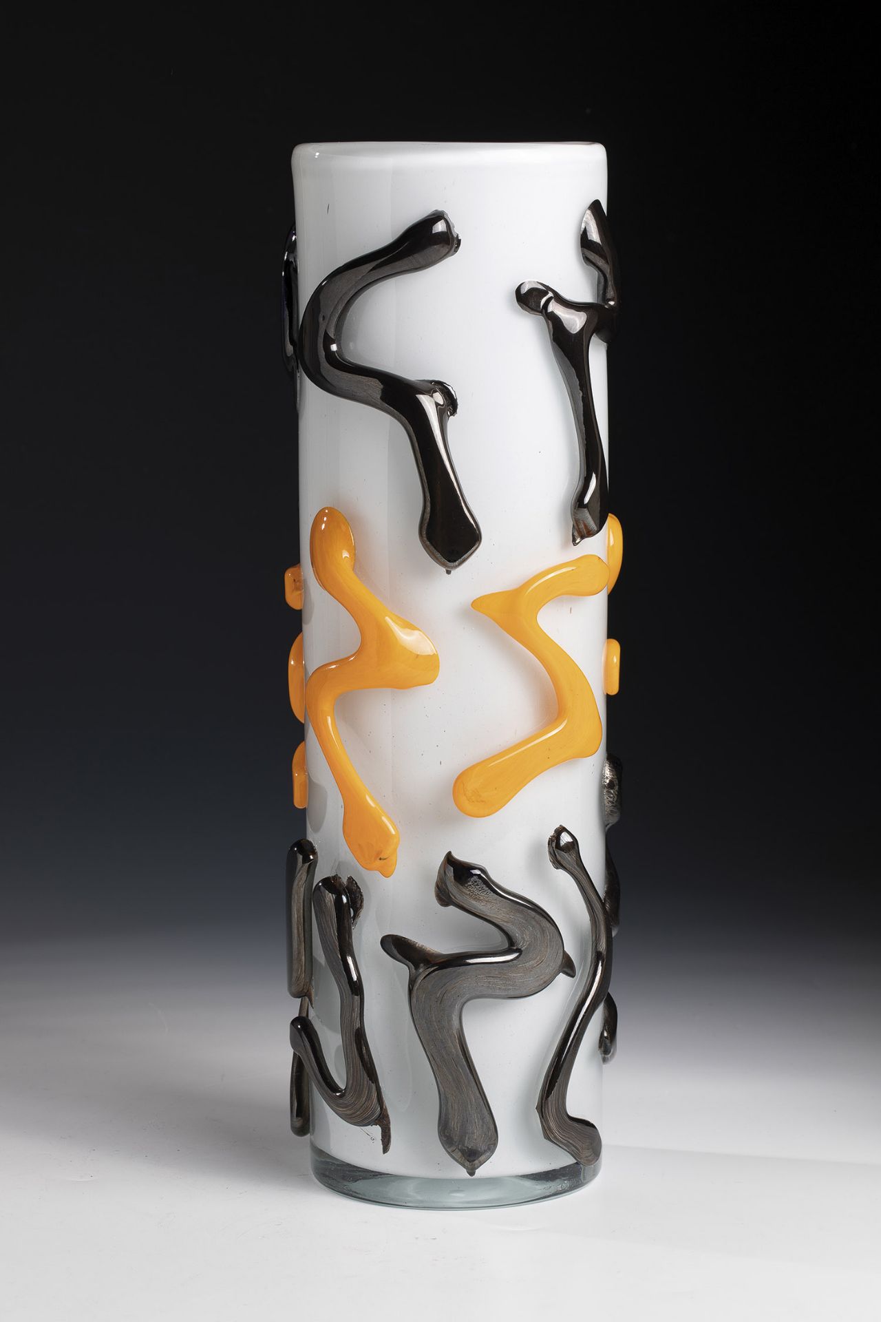 Vase Mihail Topescu (1956) Colorless glass, opaque white underlay. On the wall, freely applied,