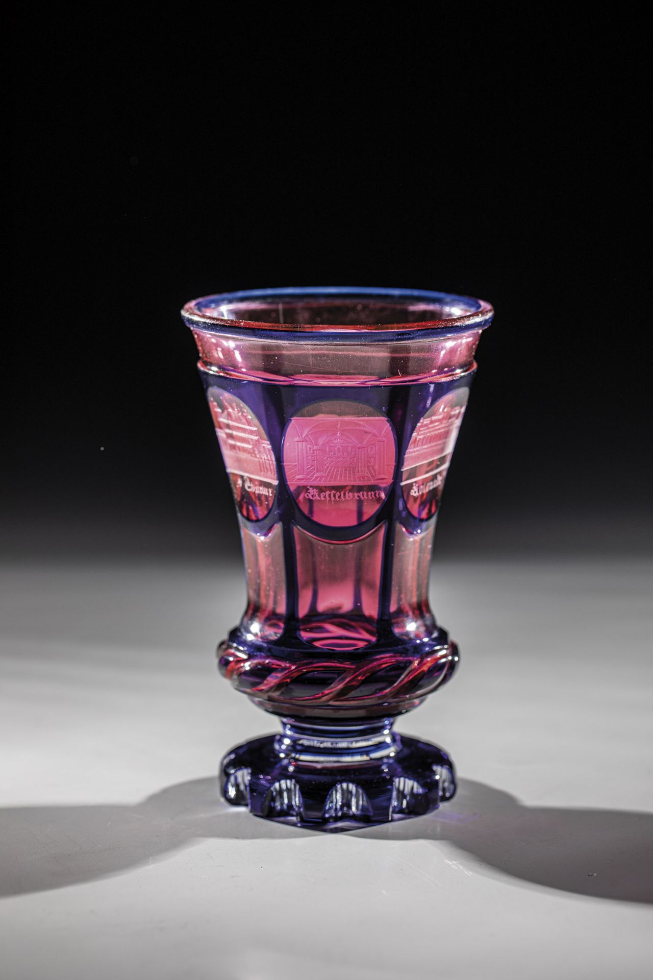 Footcup with views of Bad Ems Bohemia, 1840/50 Colourless glass, golden ruby on the inside, cobalt
