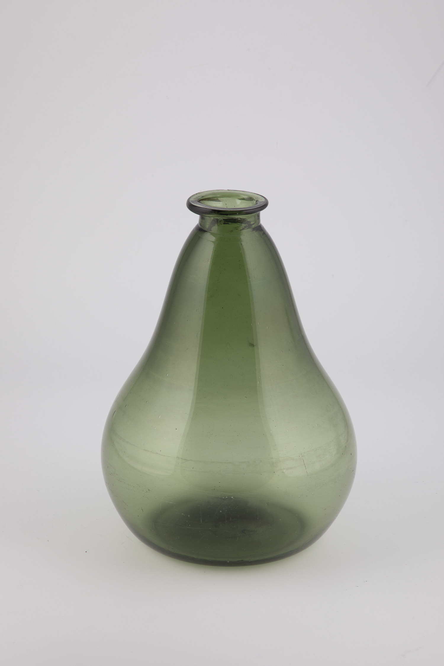 Rare storage bottle England, 19th century Green glass with slightly raised bottom and sand tear.