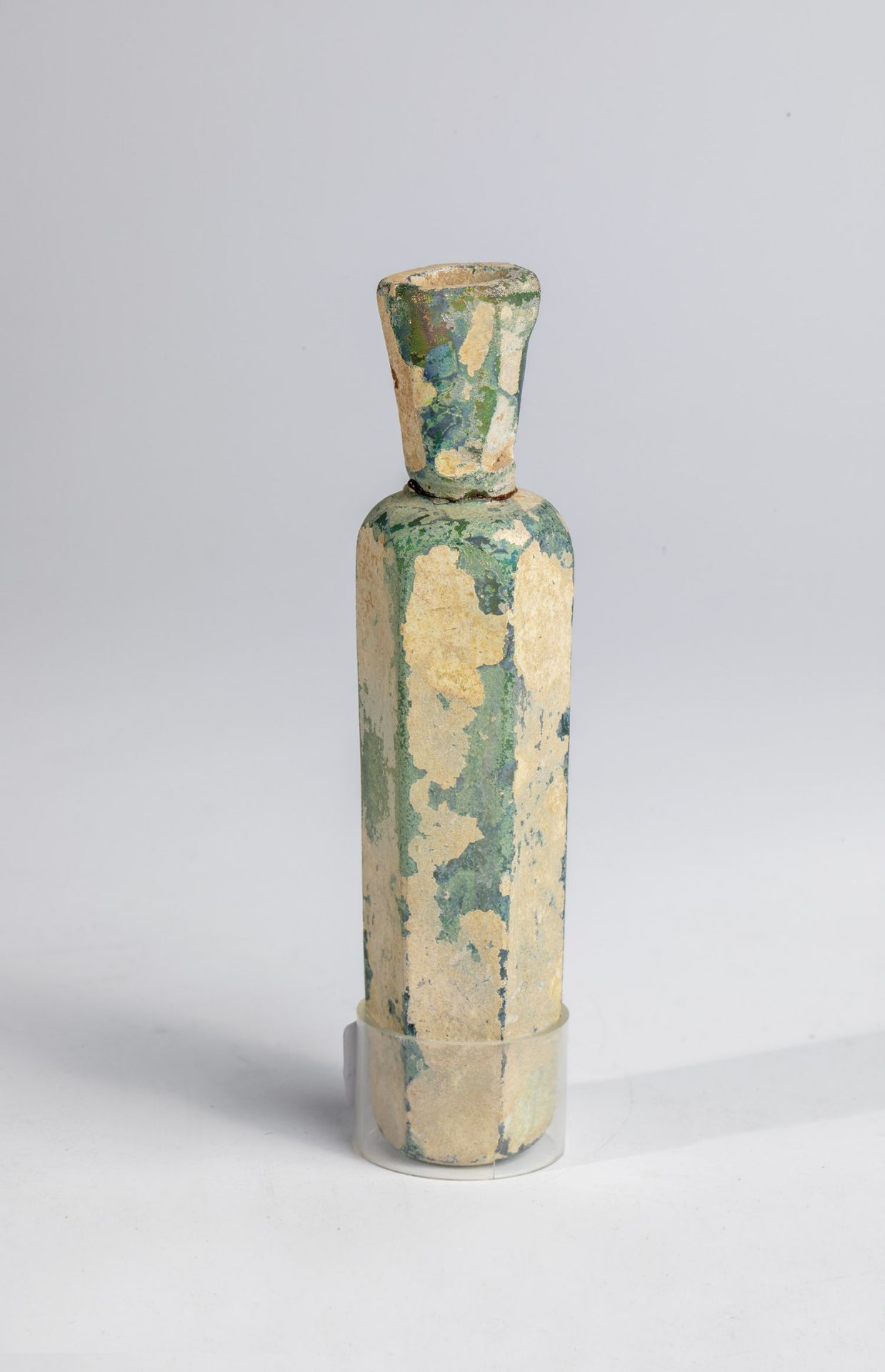 Small balsamarium probably Middle East, 9th century A.D. Greenish glass. Six-sided, slim body with