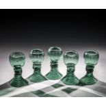 Set of five Romans Germany, 1st half of the 19th century Green glass with demolition. Woven foot.