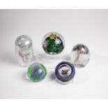 Five paperweights, 20th century, mixed lot of five paperweights made of glass. Two with signature