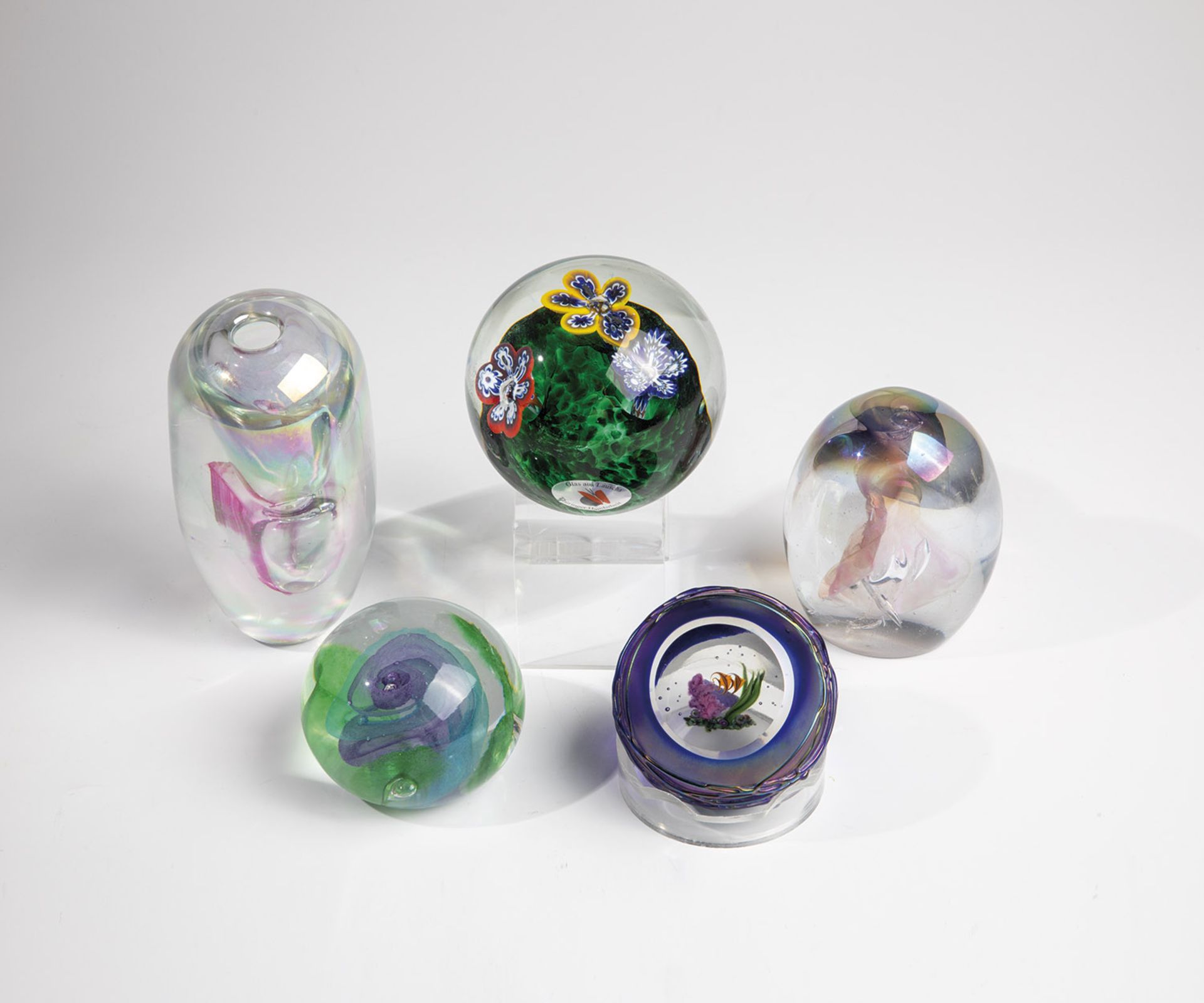 Five paperweights, 20th century, mixed lot of five paperweights made of glass. Two with signature