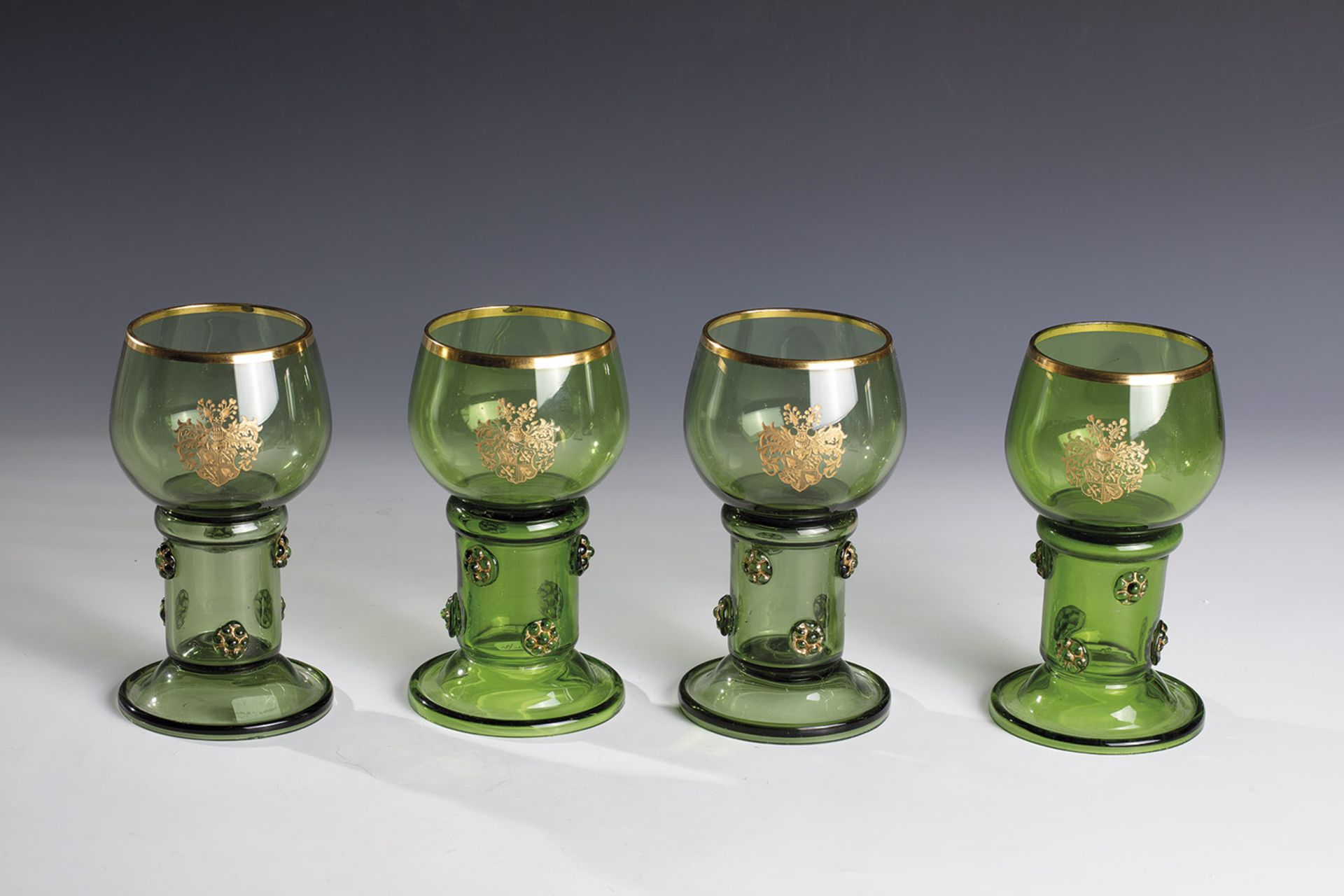 Four Romans with the coat of arms of the von Pflugk zu Rabstein, 19th century, green glass. Round