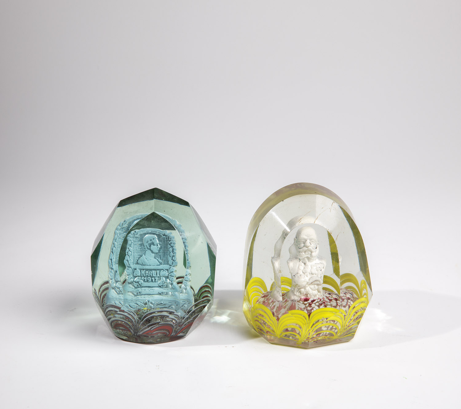 Two paperweights 20th century Two cut glass paperweights with speckled cushion and paste portrait.