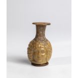 Small double-faced bottle Eastern Mediterranean, 1st-2nd century AD. Slightly brownish glass blown