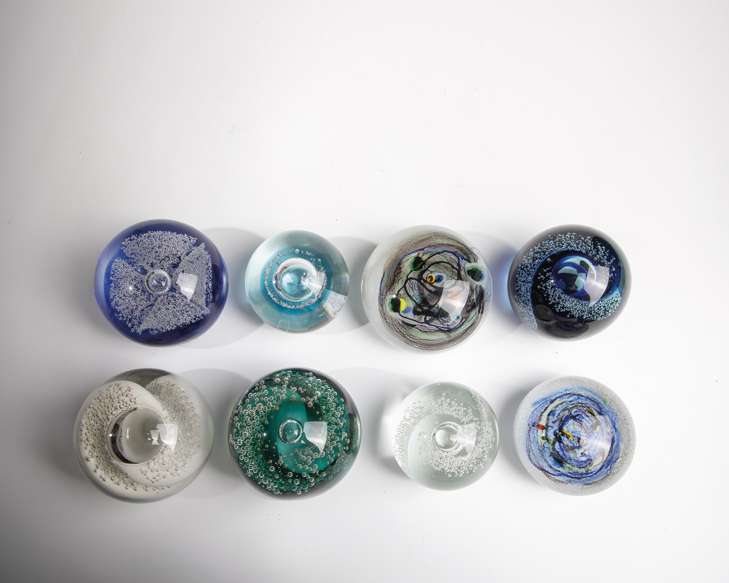 Eight paperweights 20th century Eight paperweights made of glass, most of them with enclosed air