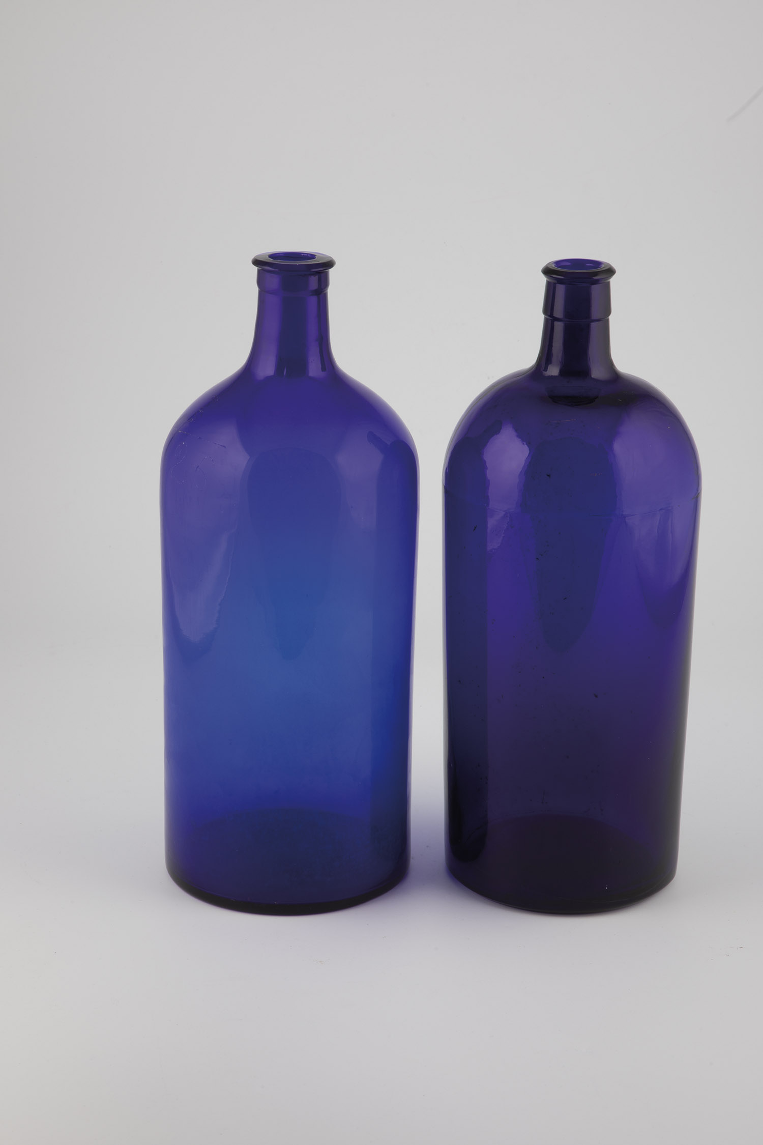 Two storage bottles of France, 19th century Cobalt blue glass. A part with scratched-in numbers.