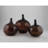 Three large spherical bottles from Alsace, 19th century Reddish-brown, partly bubbled glass.