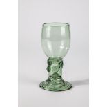 Roemer German, E. 18th century Green glass with flat, spun base, hollow shaft open to the top with
