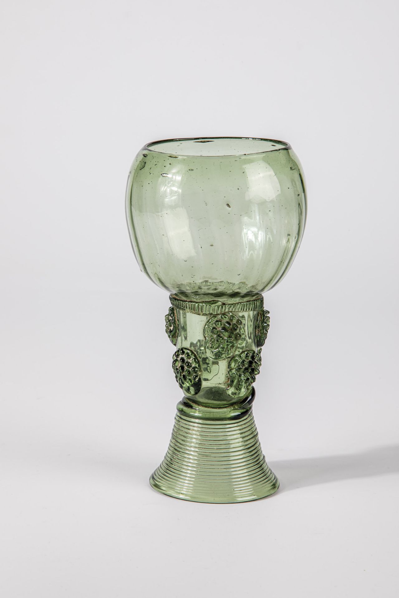 Roman German, 17th century Light green glass with demolition. Spun base, open shaft with two rows of