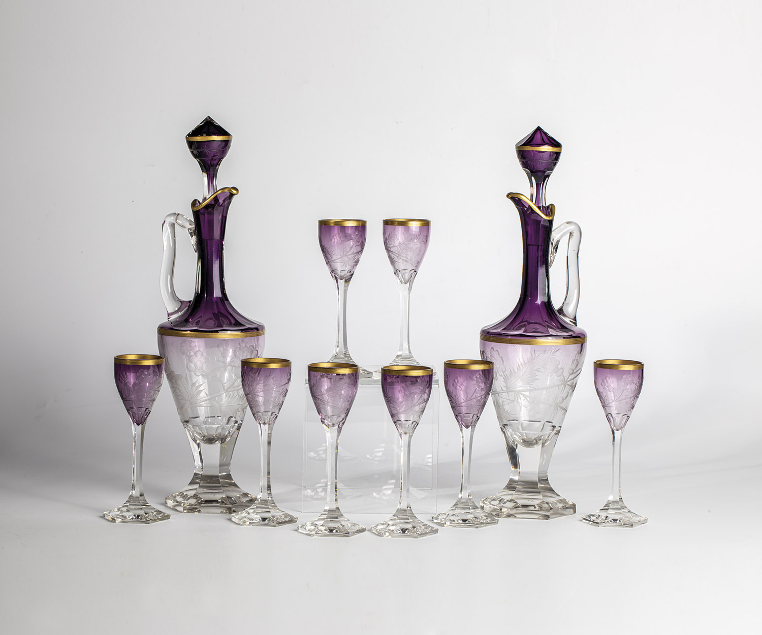 Pair of carafes with stoppers and eight liqueur glasses Moser, Karlovy Vary, ca. 1900 Colourless,