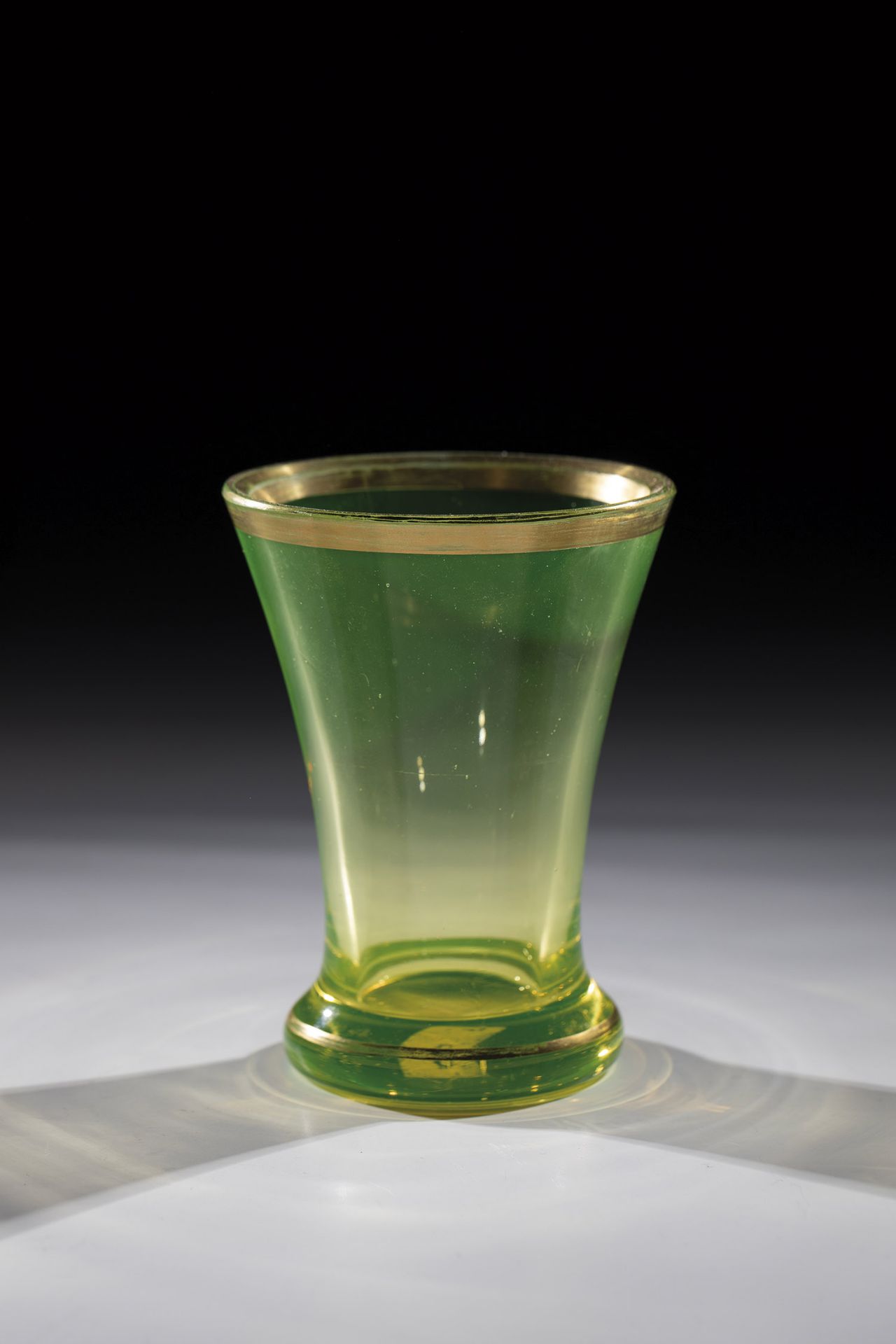 Uranium glass beaker Bohemia, 19th century Compressed stand merging into conically widened wall.