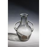 Handle carafe Probably Germany, 18th century Grey-tinted, blistered, thick-walled glass with tear-