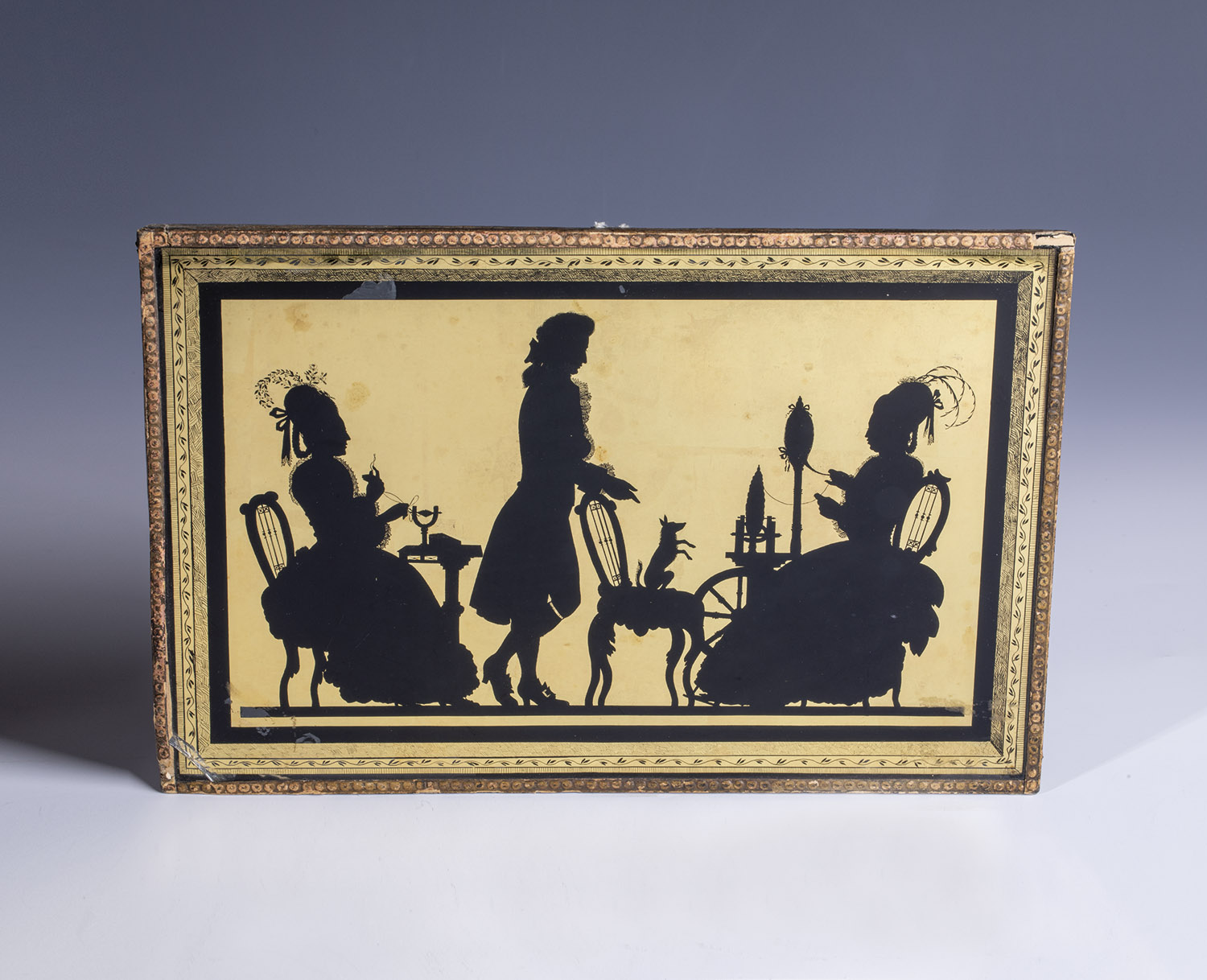 Eglomise painting Around 1800 Eglomise on glass. Two ladies doing needlework, between them A