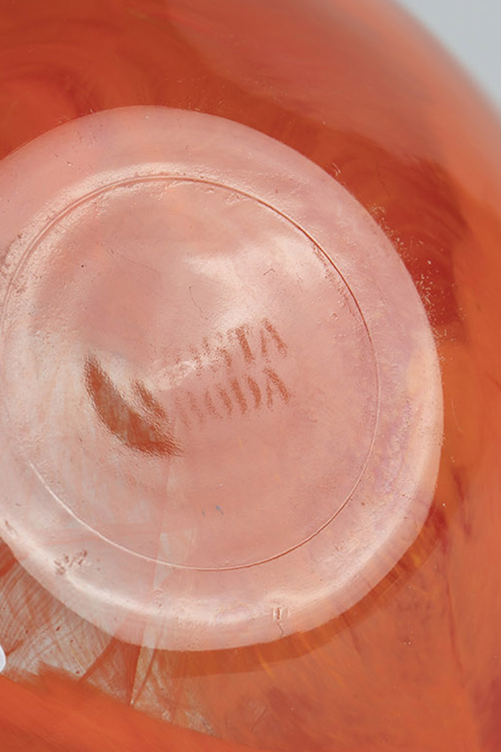 Small bowl Kosta Boda, thick-walled, colorless glass with orange interlayer decoration. Underside - Image 2 of 2