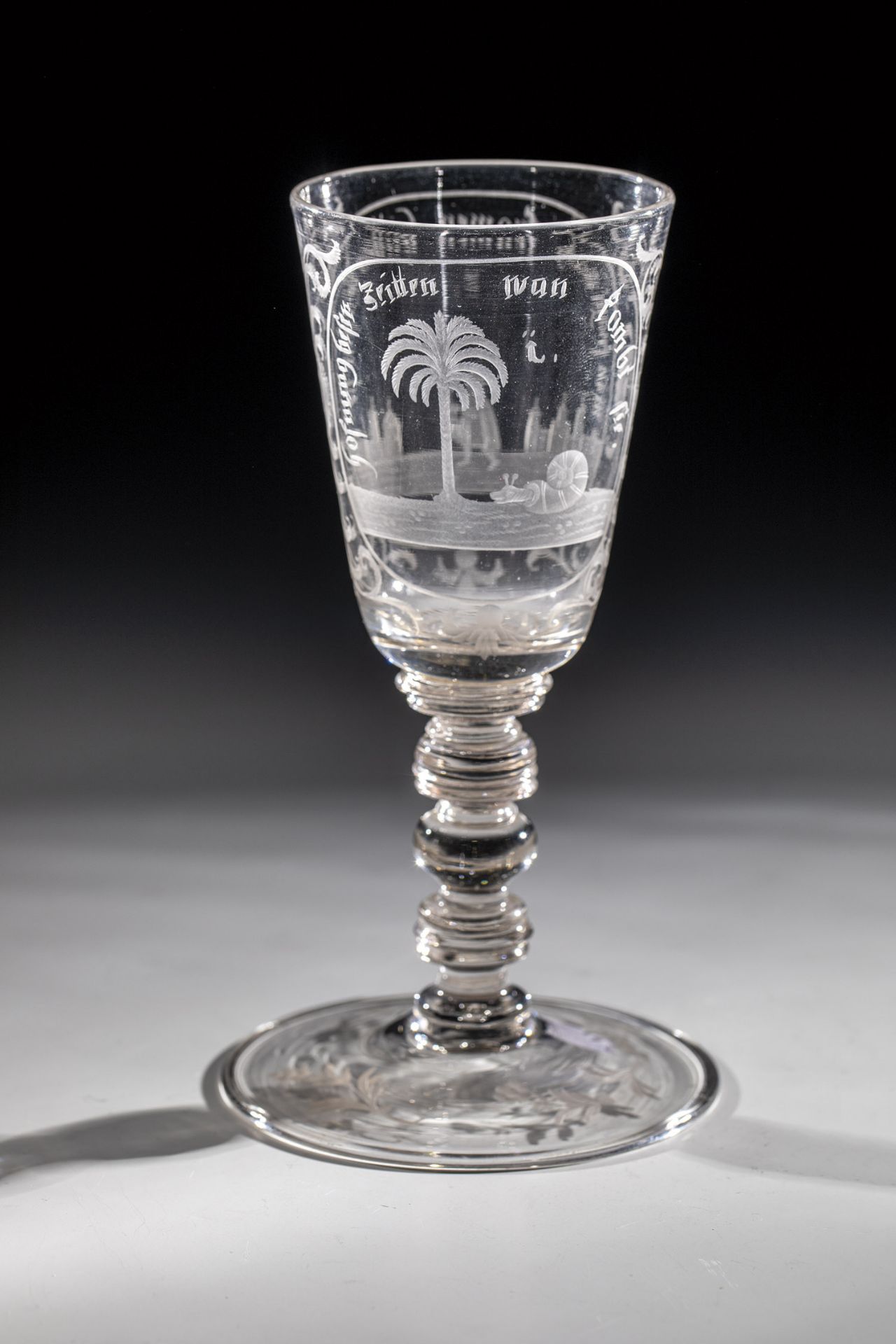 Cup of Bohemia, A. 18th century Grey-tinted glass. Disc base with tear and downward turned-edge.