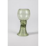 Roman German, A. 18th century Light green glass with tear-off. Spun foot, shaft open at the top with