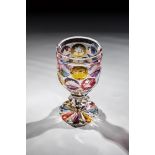 Colourless glass with glaze decoration in blue, red, violet and yellow. Fittingly sanded foot.