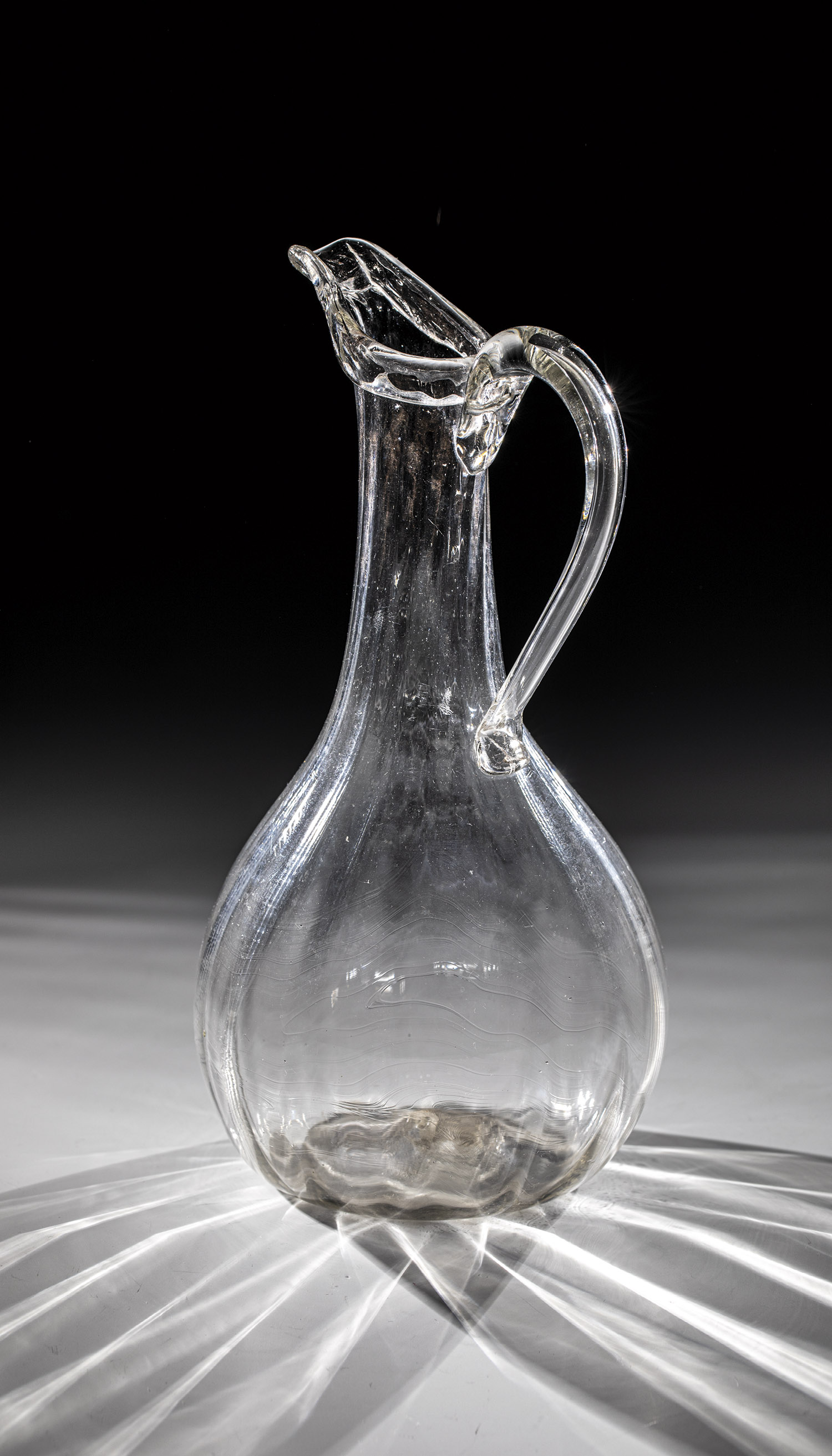 Schenkkanne E. 18th century Colourless, longitudinally optically blown glass with tear-off and