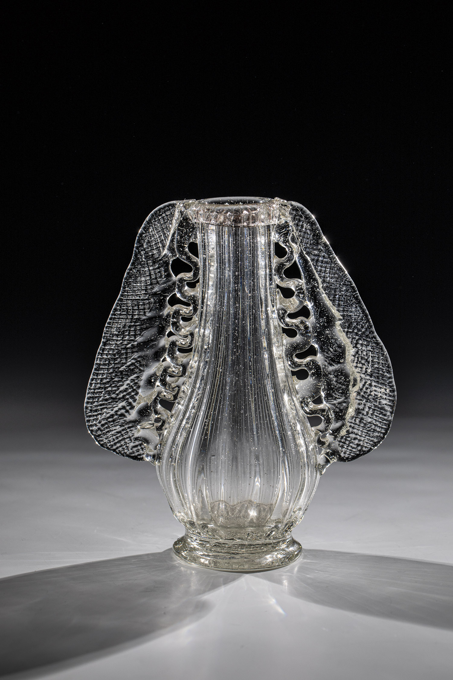 Winged vase German, probably Black Forest, A. 18th century Colourless glass with demolition.