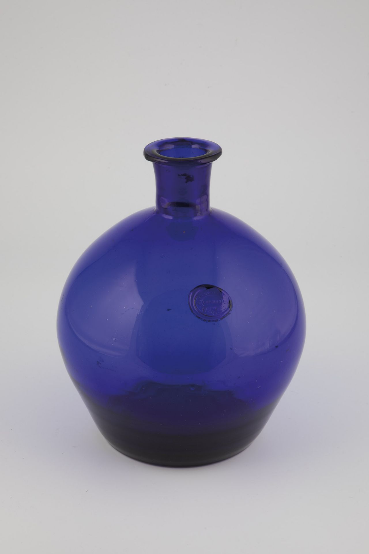 Storage bottle with seal Probably England, 19th century Cobalt blue glass with tear-off and