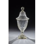 Lidded goblet A. 19th century Colourless glass. Stepped, square plinth merging into peeled shaft