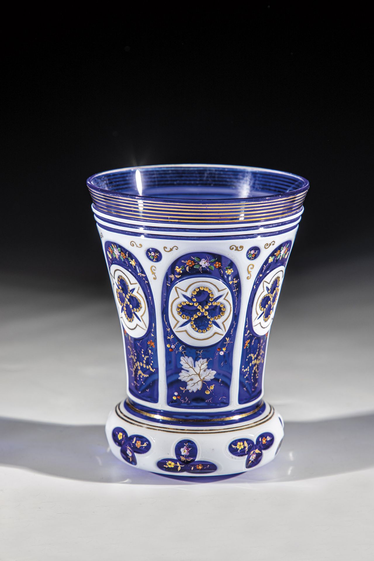 Cobalt blue glass with pewter enamel overlay. Bottom slightly hollowed. Ranft with lentil cut and