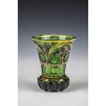 Pedestal beaker Bohemia, ca. 1840 Green glass. Stand with roller grinding decoration. The strongly