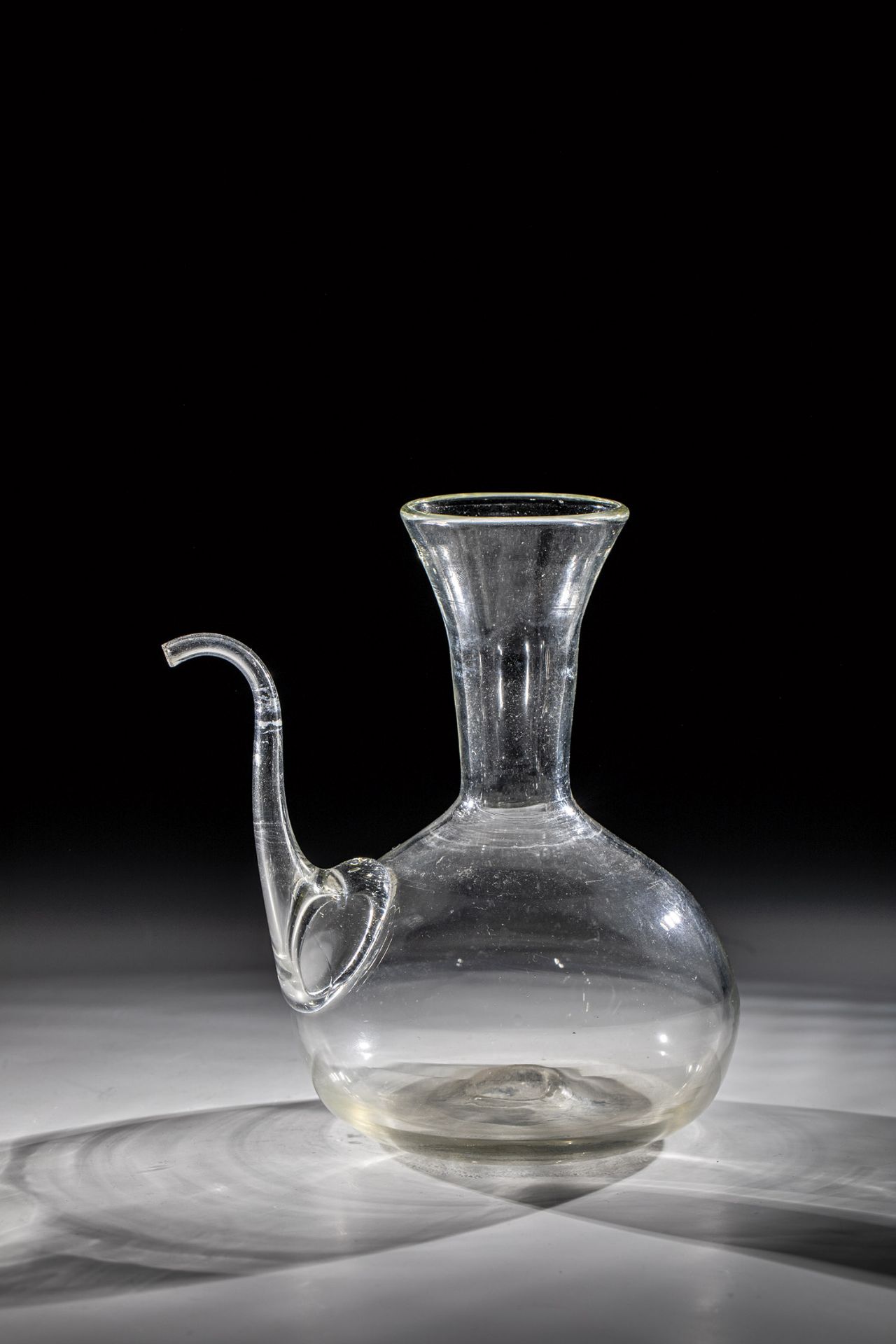 Apothecary jug 19th century Colourless glass with slightly raised bottom and tear-off. Attached