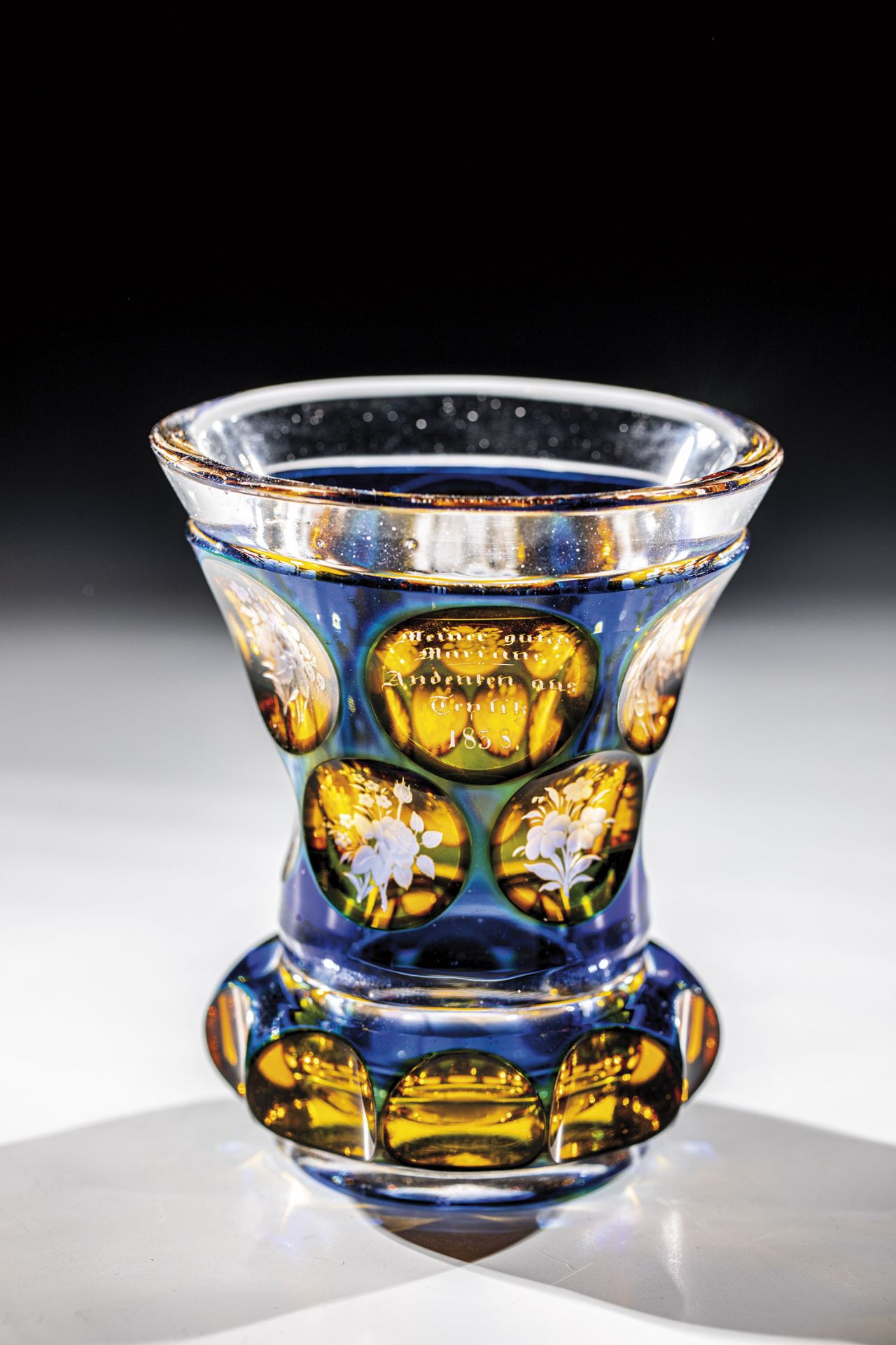 Beaker Teplitz, dated 1838 Colourless glass with cobalt blue overlay and yellow glaze. Beaded Ranft.