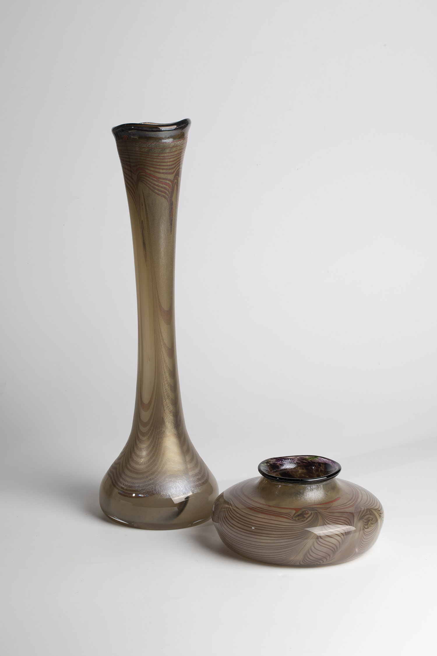 2 vases Glashuette Eisch, Frauenau, 1979 Colourless glass with fused coloured glass threads,