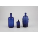 Three cobalt blue glass bottles Austria, Bad Gleichenberg, 19th century Two parts with demolition. A