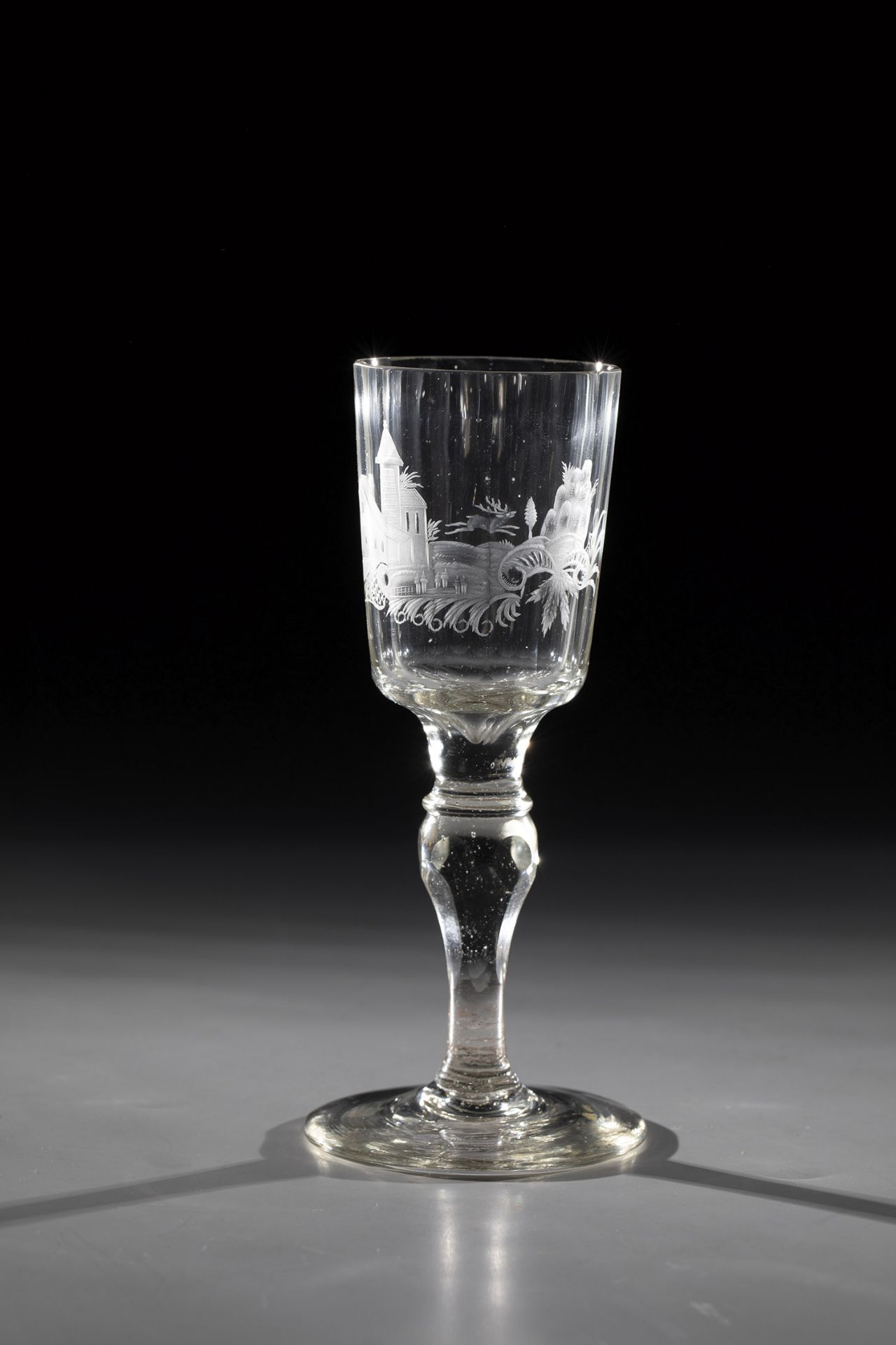 Goblet Silesia, mid-18th century Yellow-tinted glass. Faceted shaft with matt cut landscape