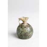 Small jug Eastern Mediterranean, 3rd-4th century AD. Light green, longitudinal optical glass with