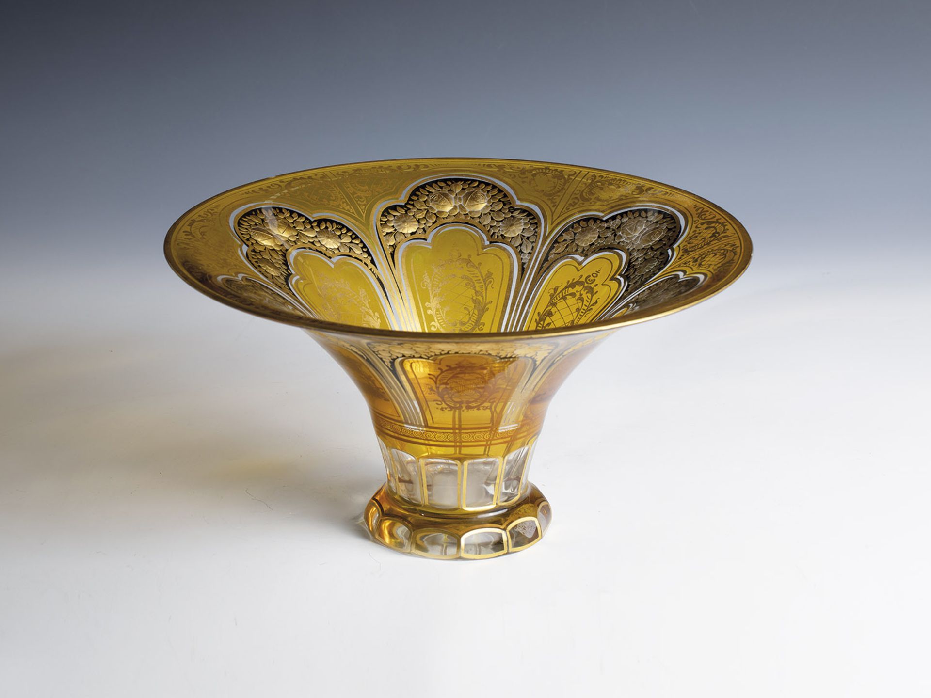 Large foot bowl Bohemia, ca. 1900 Colourless glass with yellow overlay. Rich gold painting: roses on