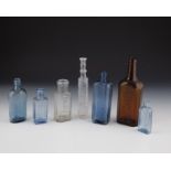 Seven bottles of Germany Colourless, greyish, blue and brown glass with relief decoration. H. 11 -