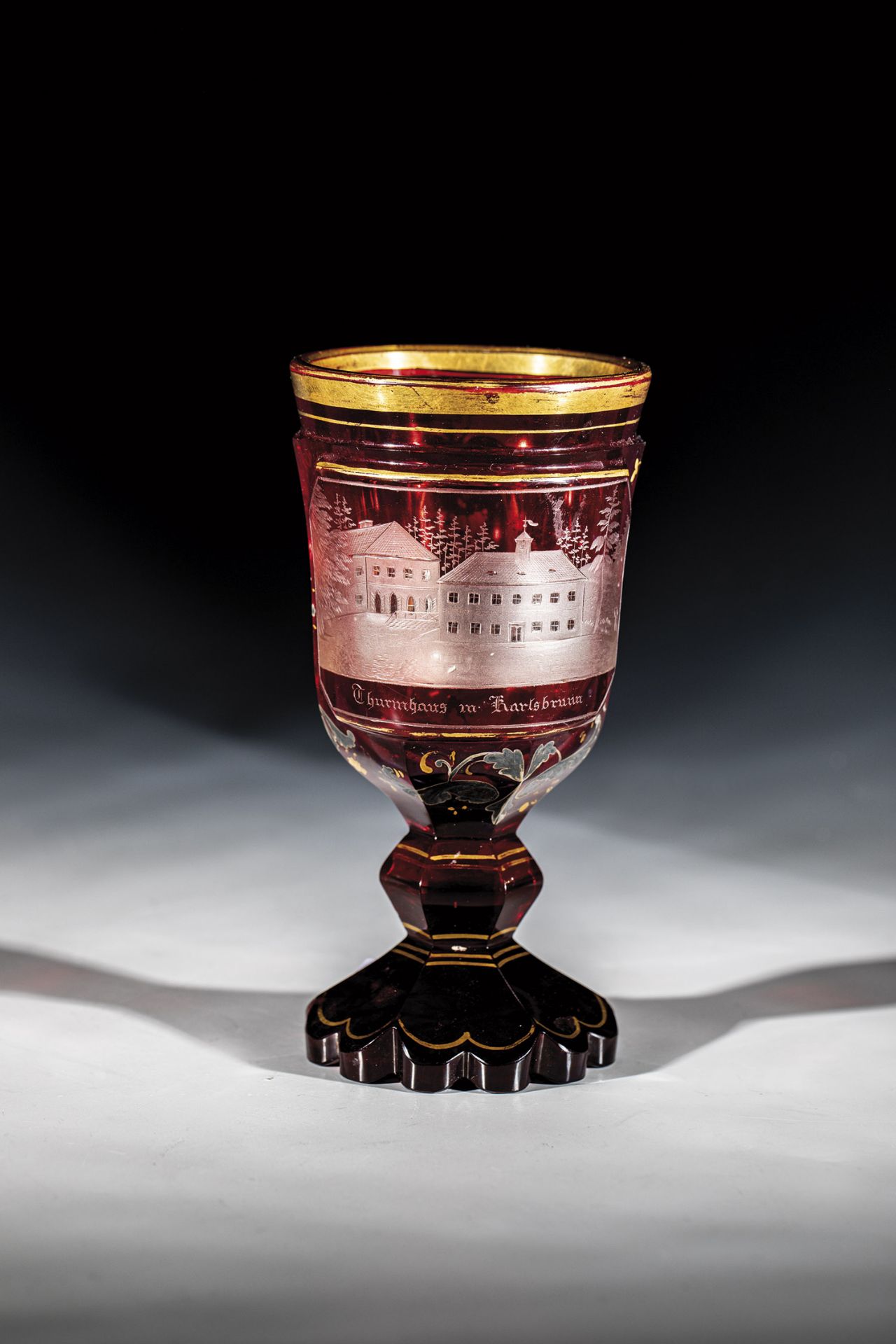 Goblet with a view of Karlsbrunn Bohemia, m. 19th century Colourless, red glazed glass with floral