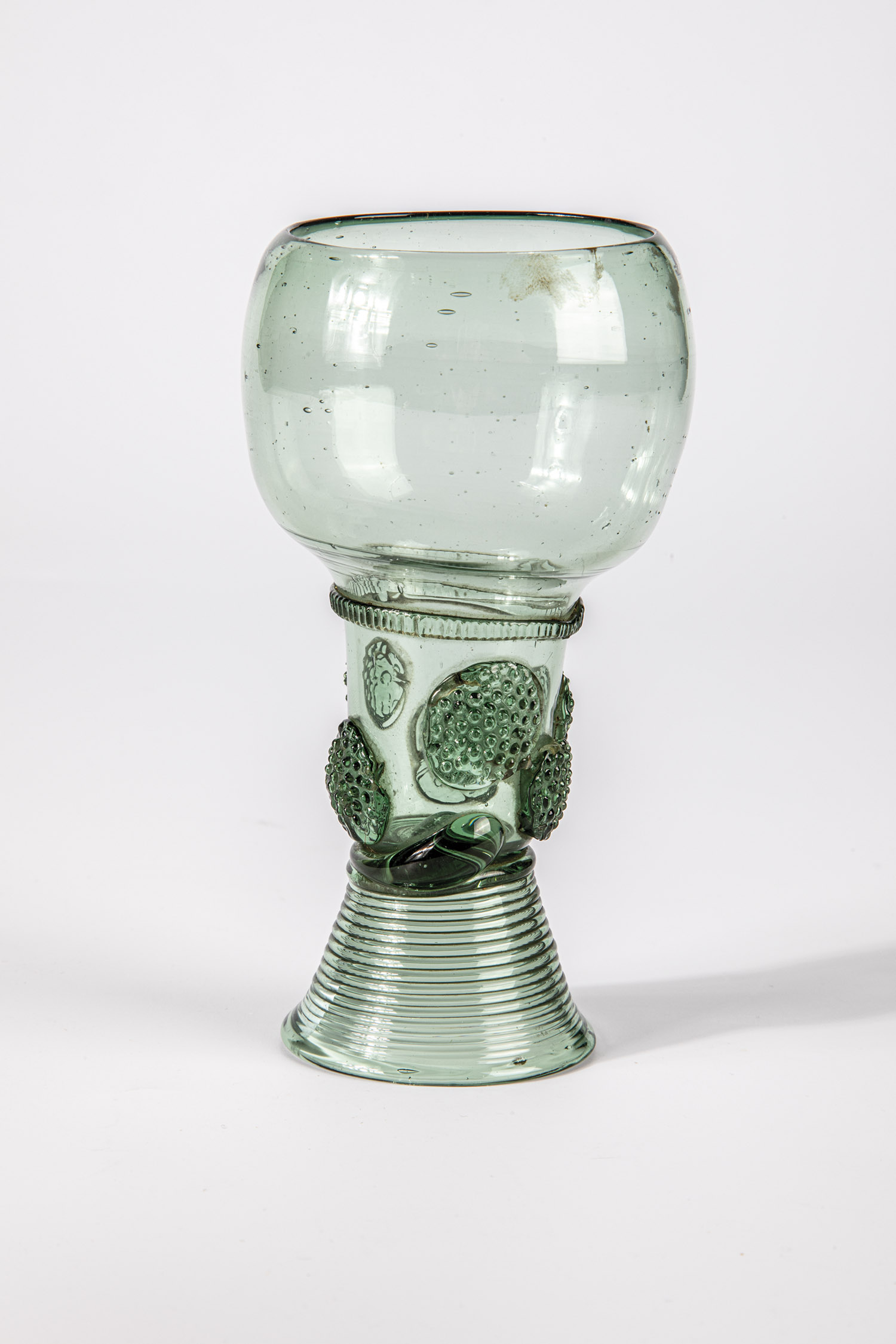 Roman German, 17th century Green glass with demolition. Woven foot. Shaft open at the top with two