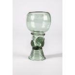 Roman German, 17th century Green glass with demolition. Woven foot. Shaft open at the top with two