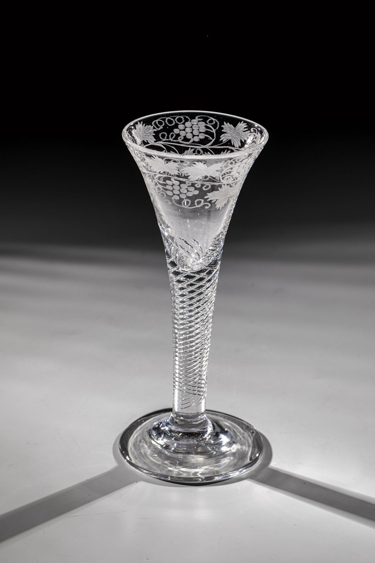 Goblet with hollow spiral threads Probably England 18th century Colourless glass. Slightly rising