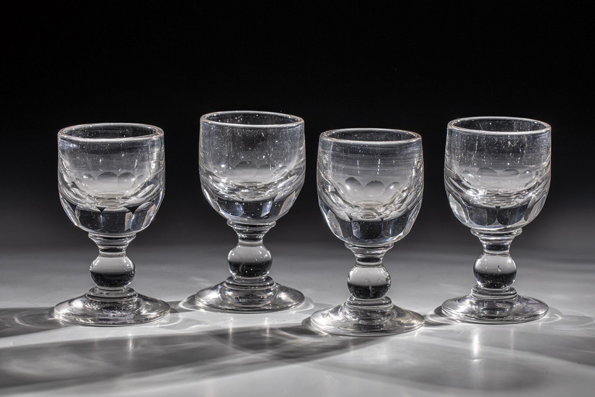 Set of four sweet wine glasses 19th century Colourless glass with tear-off. Coupling attachment with