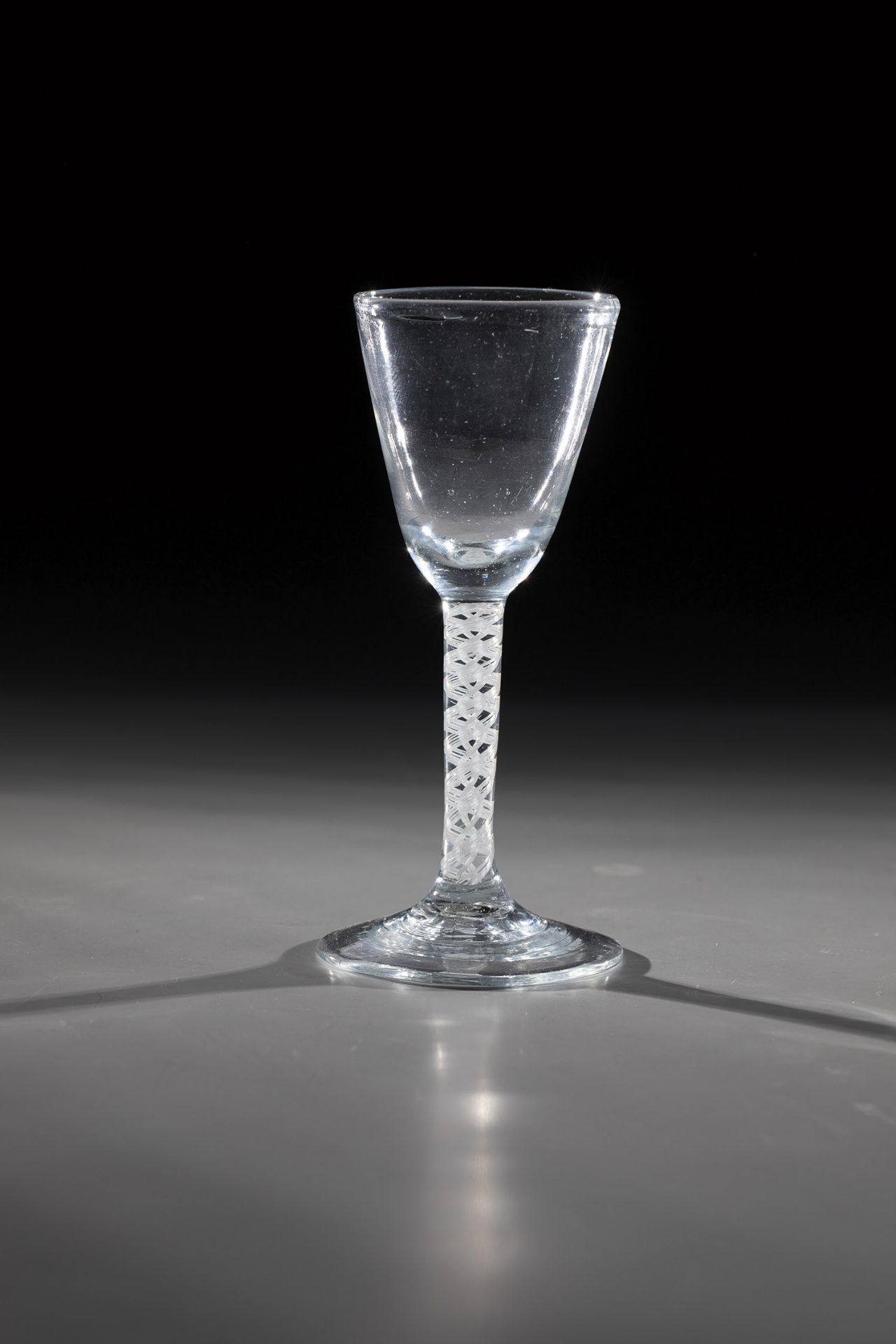 Thread glass Germany, 18th century Disc base with tear-off. Spirally enclosed frosted glass