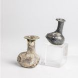 Two vials of the Eastern Mediterranean, 2nd-4th centuries AD. Greenish glass. Tapered body on one